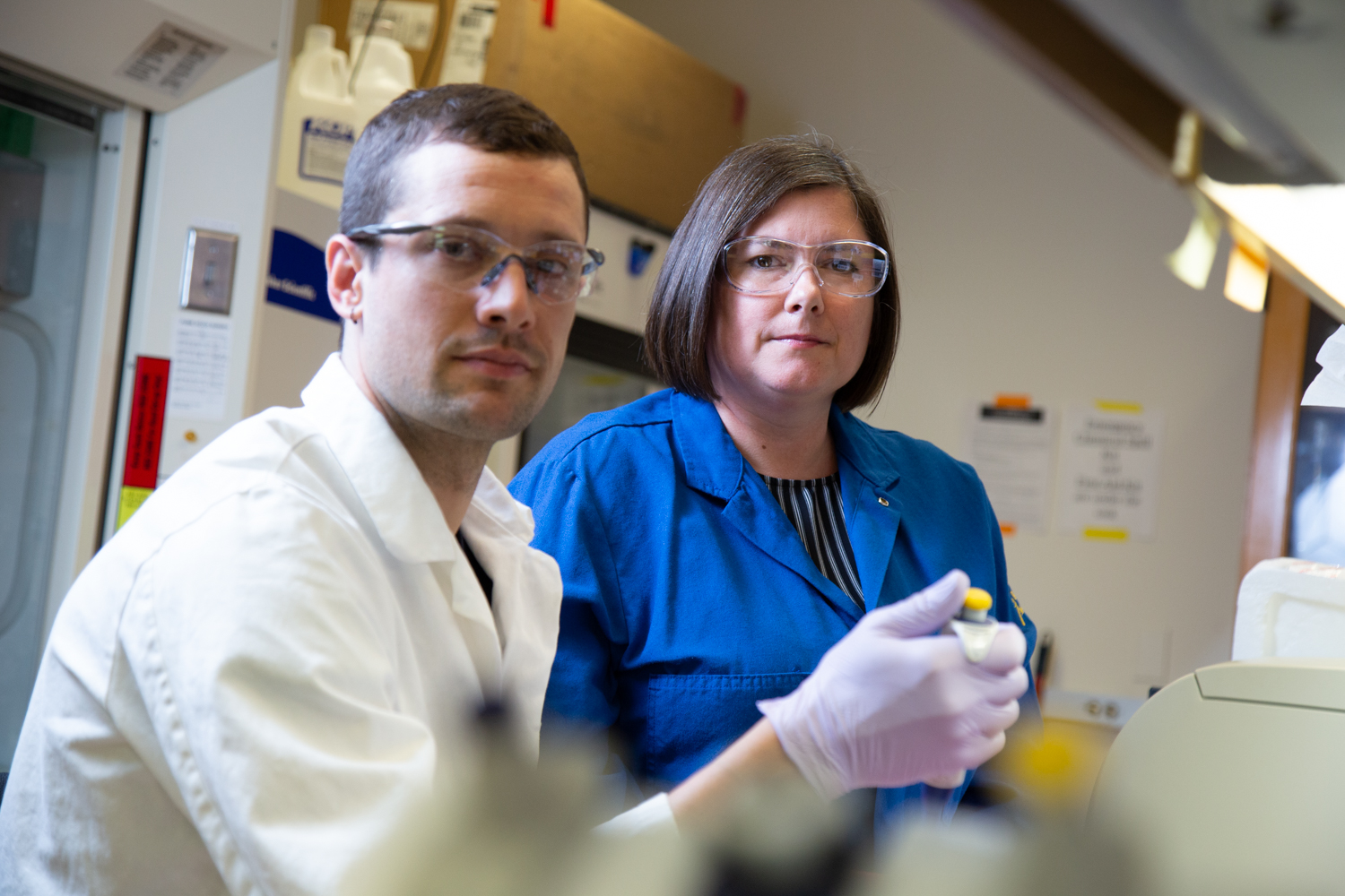 Picture of karen in her lab with a phd student