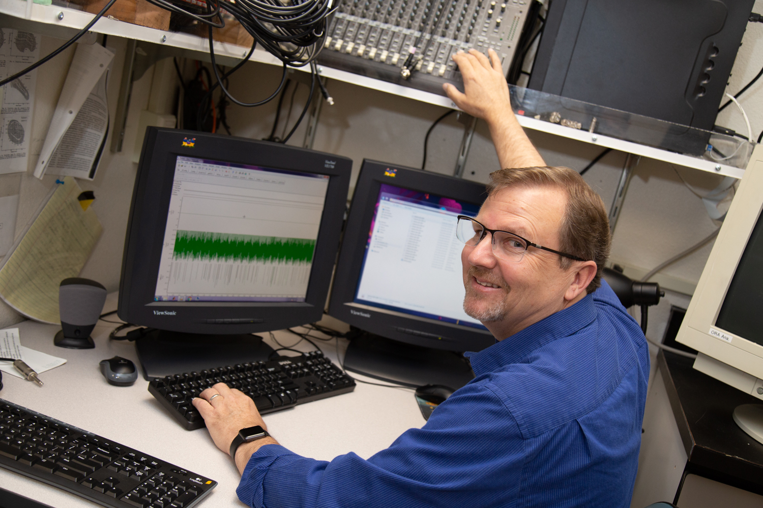 Picture of marty at a computer doing lab work